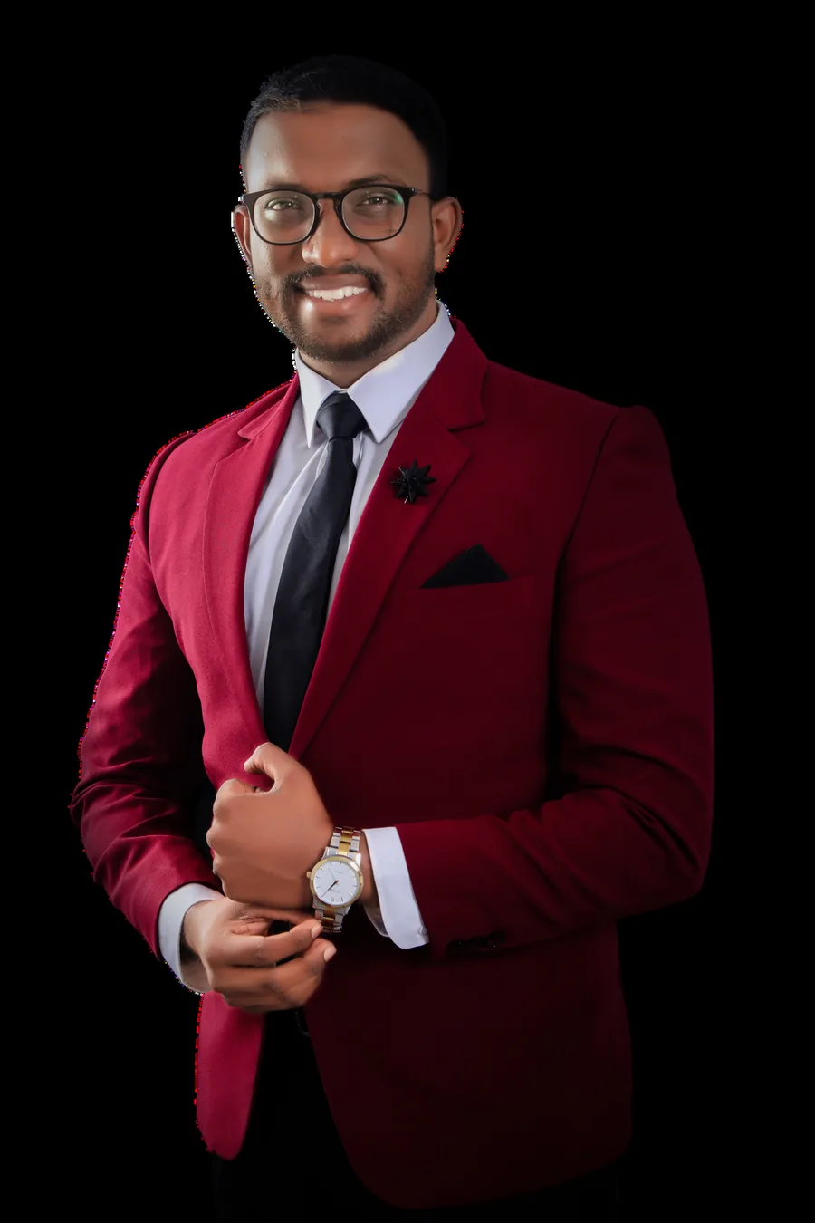 Mayantha Warnakulasooriya in a burgundy suit against a dark background
